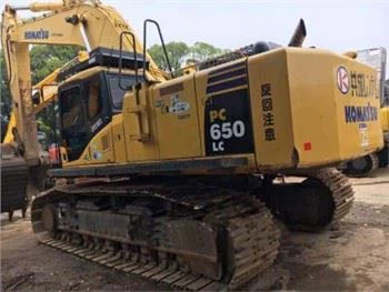 Gebrauchter Komatsu 650-8 Bagger